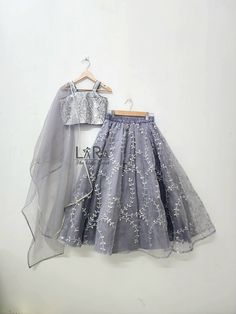 -Cute handcrafted grey colored lehenga with matching stylish sequence top is what you need for your little princess to attend the next festive or wedding gathering. -Both top and bottom have cotton and satin linning for comfort. -Please go through the size chart before placing the order, or you can text me the custom measurements if required. Feel free to ask any questions on etsy convo. I'll glad to help you out. Silver Party Dresses For Diwali, Silver Organza Lehenga For Eid, Silver Organza Sharara For Party, Silver Embroidered Party Sets, Gray Festive Sets With Resham Embroidery, Festive Embroidered Gray Sets, Organza Choli For Celebration Party Wear, Party Wear Organza Choli For Celebration, Silver Lehenga For Party And Festivals