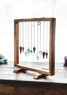 a wooden frame with several small objects in it