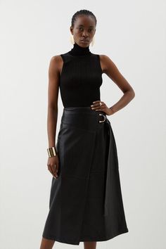 Embrace Midi Hemlines With This Piece, Crafted From Buttery Leather With A Polished Ring Detail Belt That Enfolds Around The Silhouette Forming An Asymmetric Wrap Skirt Design. Pair With A Timeless Bodysuit, Blazer And Slingback Heels For A Work To Evening Attire.Wrap Stylemidi Hemlinebeltedleather Wrap Skirt Design, Wrap Midi Skirt, Leather Tie, Leather Midi Skirt, Womens Business Casual, Slingback Heels, Tops Blouse, Black Midi Skirt, Faux Leather Skirt