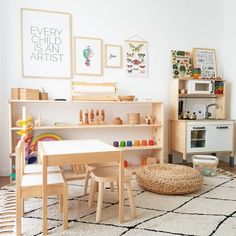 a child's playroom with wooden furniture and art work on the wall above it