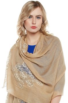 Let your friends, peers, companions and everyone around you know about the glory of your roots with a winter stole handwoven in the regality of Kashmiri Pashmina. The stole features a minimal mocha base tone, which is embellished around the fringes in a contrasting gold French Chantilly lace, making this piece a must buy for the women who know how to dress up in traditions, even in the modern world. Elegant Beige Pashmina Shawl With Traditional Drape, Elegant Winter Dupatta Scarf, Beige Pashmina Dupatta, Elegant Scarf With Traditional Drape For Winter, Elegant Scarves With Traditional Drape For Winter, Elegant Winter Scarves With Traditional Drape, Cream Dupatta Shawl, Winter Cream Pashmina Shawl, Beige Embroidered Pashmina Scarf