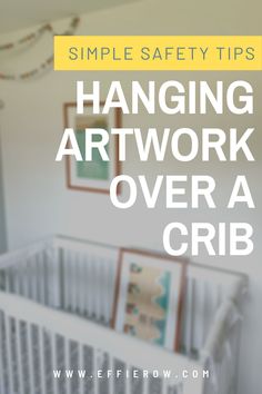 a baby crib with the words hanging art work over it's crib