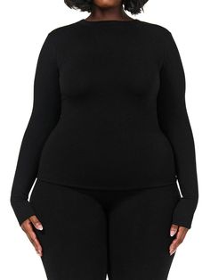 This simple body hugging top comes your way with a crewneck design and long fitted sleeves. Hugs your shape and accentuates your curves. Pair with our matching bottoms and more. NW Collection Legacy Collection Import 95% Viscose, 5% Spandex Model wears size 1X True to size This top is double-lined Fitted Seamless Long Sleeve Top, High Stretch Crew Neck Long Sleeve Top With Thumbholes, High Stretch Crew Neck Top With Thumbholes, Solid High Stretch Long Sleeve Top For Layering, Stretch Crew Neck Long Sleeve Top, Fitted Long Sleeve Loungewear Top, Stretch Elastane Long Sleeve Crew Neck Top, Stretch Elastane Crew Neck Long Sleeve Top, Black Stretch Long Sleeve Top For Loungewear