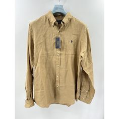 Elevate Your Wardrobe With This Polo Ralph Lauren 100% Linen Button Down Shirt In Size Xl. Designed For Men, This Casual Button-Down Shirt Features A Classic Button-Down Collar And Long Sleeves. The Brown Color And High-Quality Linen Material Make This Shirt Perfect For Any Occasion. With Tags Still Attached, This Shirt Is Brand New And Has Never Been Worn. The Polo Ralph Lauren Brand Speaks For Itself In Terms Of Quality And Style, And This Shirt Is No Exception. Add It To Your Collection Today Beige Button Closure Shirt For Business Casual, Casual Beige Shirt With Button Closure, Classic Tops With Casual Collar And Buttons, Classic Tops With Buttons And Casual Collar, Classic Brown Shirt With Casual Collar, Beige Button-up Shirt With Button Closure, Casual Brown Shirt With Button Cuffs, Classic Brown Tops With Casual Collar, Classic Brown Top With Casual Collar