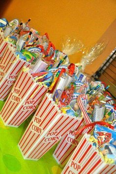 many popcorn bags are lined up on a table