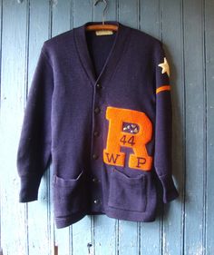 This is a navy blue wool cardigan school sweater from 1944.  It's by Imperial Knitting of Milwaukee.  The size is 36.  This sweater has a letter and a star and date, along with assorted pins.  Great condition, just one repaired small hole in the back.  Comes from a smoke free home. Measurements: Chest:  36"     Hip:  36"  Taken without stretching.     Across Shoulder:  18"   Sleeve Length:  21.5"     Length: from back base of neck band to hem:  28"  Please ask me any questions you may have before buying as this is a final sale. Please know your measurements and allow for movement.  I ship within 3 business days of payment, usually sooner. If you need something quickly, just let me know. I am happy to combine shipping on multiple purchases, except heavy winter coats, to save money. Thank yo School Cardigan, School Sweater, Heavy Winter Coat, Pullover Outfit, Blue Wool, Wool Cardigan, Milwaukee, Winter Coat, Cardigan Sweater