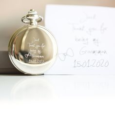 A modern and timeless pocket watch that we will carefully engrave with your own handwriting. The roman numerals give it a twist of classic styling. Complete with a skeleton view which allows you to see all the inner workings of this beautifully hand-crafted timepiece. A gift that will be cherished forever.      Personalised skeleton pocket watch     Engraved with you handwriting     Personalised here in the UK     Includes gift box with ribbon & zig-zag shread     Size: 47mm wide     Mechanical wind-up movement     Skeleton view to see all moving components     Roman numeral dials      --- Own Handwriting Instructions --- 1. Take a blank piece of paper and write/draw what you would like engraved. 2. Take a photo of your creation and email it to alicjaborys82@yahoo.co.uk Modern Pocket Watch, Drawing Back, Skeleton Pocket Watch, Gift Box With Ribbon, Engraved Handwriting, Be My Groomsman, Box With Ribbon, Personalized Watches, Watch Engraving