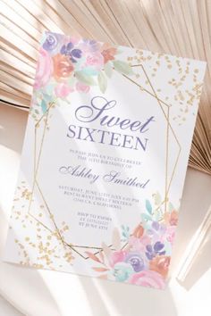 an elegant floral wedding suite with gold foil and flowers on the front, along with a white card that says sweet sixteen