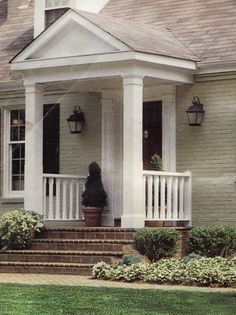 a person standing on the front porch of a house