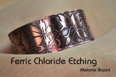 a close up of a metal object on a white surface with the words ferric chlorde etching