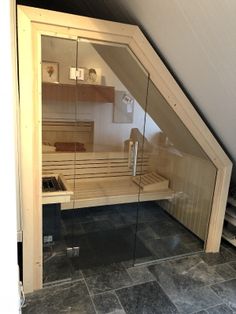 an attic sauna in the corner of a room