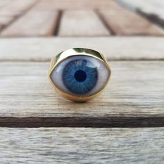 Evil Eye Medium Signet Ring. This beautiful ring is quite a statement. If you love different unique jewelry, then this ring is for you!. Chunky and heavy in both material versions. This eye ring is made to order in two different materials: .925 sterling silver Solid 18k gold (yellow or white). For a small additional fee, we also offer the option to engrave something in the inside of the band, like a name, a date, etc. Please allow up to 4 -6 weeks to work in your order. Some times it can take on Mystical Internally Threaded Jewelry As Gift, Mystical Internally Threaded Jewelry For Gift, Mystical Internally Threaded Jewelry For Gifts, Eye-catching Handmade Jewelry For Gifts, Eye-catching Evil Eye Jewelry For Gift, Unique Evil Eye Jewelry Gift, Unique Evil Eye Jewelry As A Gift, Unique Eye-shaped Jewelry For Gifts, Handmade Spiritual Eye-shaped Jewelry