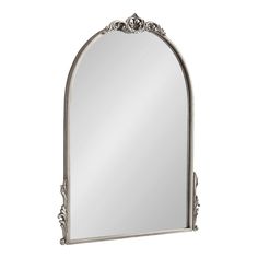 an ornate silver framed mirror on a white background