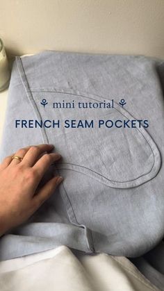 someone is stitching the french seam pockets on a blanket