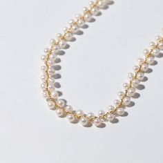 Showcase your elegance with the Handwoven Freshwater Pearl Necklace, a delicate piece designed to highlight the natural beauty of freshwater pearls. This necklace features a stylish O-chain adorned with small, naturally colored pearls. The handwoven design and adjustable sliding extender ensure a perfect fit, making it an exquisite accessory for any outfit. Crafted with 18K gold-plated copper components, this necklace combines sophistication with versatility. Product Details Material: 18K Gold-P Pearl Lariat Necklace With Beaded Pearl Chain, Pearl Lariat Beaded Necklace, Everyday Adjustable Pearl Chain Necklace, Adjustable Everyday Pearl Chain Necklace, Adjustable Dainty Pearl Drop Necklace, Delicate Adjustable Pearl Pendant Necklace, Dainty Adjustable Pearl Drop Necklace, Delicate Adjustable Beaded Necklace With Pearl Charm, Delicate Adjustable Pearl White Necklace