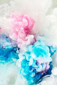 colorful ink is mixed in with white and blue