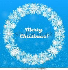 merry christmas card with snowflakes in the center on a blue background - stock photo