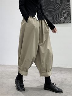 Baggy Khaki Ankle-length Pants, Khaki Solid Color Bottoms For Fall, Khaki Baggy Ankle-length Pants, Solid Color Khaki Bottoms For Fall, Trendy Baggy Khaki Bottoms, Baggy Khaki Bottoms With Elastic Waistband, Baggy High-waisted Khaki Harem Pants, Baggy Solid Color Harem Pants For Fall, High Waist Baggy Khaki Harem Pants