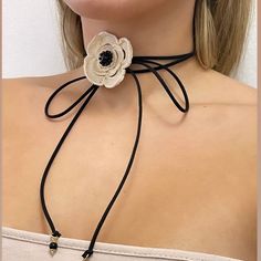 * Choker necklace with crochet camellia, onyx and crystals, nubuck black with fine onyx knot. * Dimensions: adjustable one size with the possibility of double turn around the neck. * Made in Italy Nov 6, Choker Necklaces, Onyx, Choker, Choker Necklace, Knot, Handmade Items, In Italy, Jewelry Necklaces