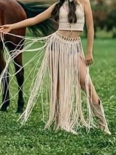 This milky white macrame skirt will be the best choice for your boho style image. White long boho skirt is suitable for your  wild style photoshoot wear.  This macrame skirt also is perfect choice for vacation outfit or festival outfit. Be wild and elegant at the same time! Suitable for XS-S sizes. It is flexible for sizes, because it's tied and belted around the neck and the waist. Length 110 cm (43 inch).  YOU CAN CONTACT ME FOR DIFFERENT COLORS, SIZES AND SPECIAL DESINGS. The item is made of White Bohemian Maxi Skirt For Festival, Beach Long Skirt With Tassels, Long Beach Skirt With Tassels, Bohemian White Bottoms With Fringe, Hippie White Skirt For Festivals, White Bohemian Bottoms With Fringe, Beige Maxi Skirt For Festival, White Fringe Bottoms For Festival, White Tassel Skirt For Spring