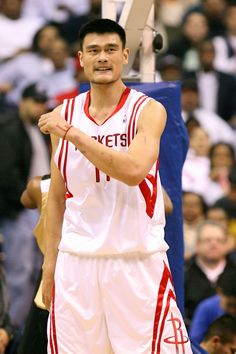 a basketball player is holding his hand up in the air