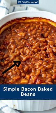 a white bowl filled with baked beans on top of a table