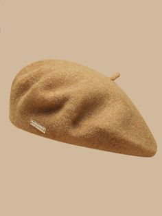 a brown hat is shown on top of a tan background with the words,'i am