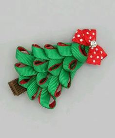 a bunch of green and red bows on top of each other