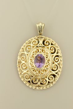 This wonderful filigree locket is made in 14K yellow gold and holds a spectacular purple topaz oval center. The piece measures 44.60mm long, 34.5mm wide and sits 13.17mm tall. If you need a chain to go with this, feel free to reach out to us and we can discuss options. B2264KALP --Please reference our policy for more details-- For International orders, please provide a phone number for shipping purposes. Just place a note in the comment box during check out.Thank you.** International wrist watch Oval Yellow Gold Filigree Jewelry, Purple Oval Filigree Jewelry, Oval Purple Jewelry With Intricate Design, Oval Locket, Filigree Pendant, Gold Locket, Gold Filigree, Oval Cut, Pendant Necklaces