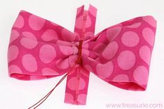 a pink bow tied to a string