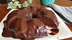 a chocolate bunt cake on a white plate