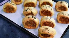 several sausage rolls on a baking sheet ready to be baked