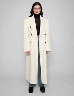 Off-white wool oversized coat with padded dropped shoulders and contrast buttons . Brand Pixie Market Dropped shoulders 100% woolSide pockets Size S: shoulder 20"/50cm bust 39"/98 length 51"/128 cm sleeve length25"/62.5 cmSize M: shoulder 21"/51 bust 41"/102cm length /52"/130.5 cm sleeve length25.5"/26.5cmModel is wearing a size small and model's height is 5.7"/170 cmImported ​ White Long Coat Outfit, Long Jacket Outfit, White Coat Outfit, Wool Coat Outfit, White Long Jacket, Long Coat Outfit, White Wool Coat, White Winter Coat, Trip Outfit