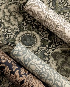 an assortment of wallpapers in various colors and patterns, including blue, green, brown, black and white