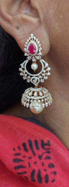 18 karat gold '3 in 1' detachable diamond jhumkas - diamond dangle earrings with color stones & pearls
  this product has inter changeable stones in the earrings
  width of the jhumka : 0.90 inches
  note: only front side has diamonds as shown in the picture, the back part of the jhumka which is not visible from the front is only gold without diamonds
    

introducing our exquisite 18 karat gold '3 in 1' detachable diamond jhumkas, the epitome of elegance and luxury. crafted with precision and Luxury White Chandbalis For Women, Luxury Diamond Hand Set Jhumkas, Luxury Chandbalis Drop Earrings For Celebration, Luxury Hand Set Fusion Diamond Earrings, Chain Earrings Dangle Totaram Jewelers, Elegant 22k Gold Chandbalis Luxury, Luxury Fusion Chandbalis With Intricate Design, Diamond Chandbali Bridal Earrings, Diamond Danglers With Intricate Design For Reception