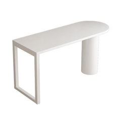 a white table sitting on top of a white floor