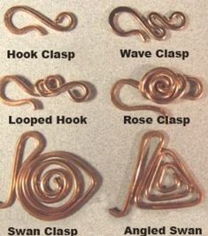 several different types of hooks on a white surface