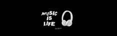 headphones with the words music is life written on them in white ink against a black background