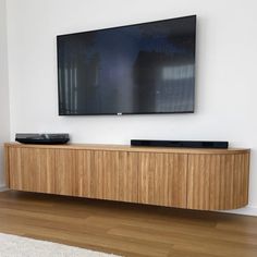 a flat screen tv mounted to the side of a wall