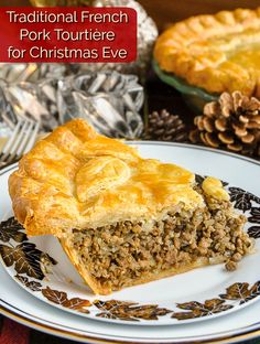 a piece of pie on a plate with the title traditional french pork tourniere for christmas eve