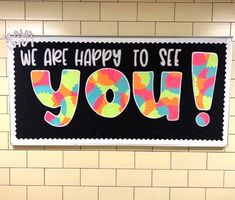 there is a sign that says we are happy to see you on the wall in the bathroom