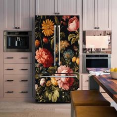 a kitchen with a refrigerator covered in flowers