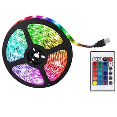 the multicolored led strip light is next to a remote control for lighting up