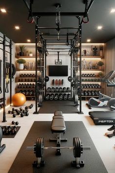 a home gym with lots of equipment in the room and on the wall, there are two rows of dumbbells