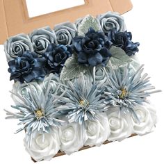 a box filled with blue and white flowers