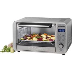 a silver toaster oven with food in it