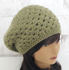 Product Overview: This listing is for a ready-to-ship hand crocheted olive green granny stripe slouchy beanie. Details: ✤ Item Description:  Hand crocheted pink granny stripe slouchy beanie ✤ Materials: 100% Acrylic ✤ Color: Olive Green Products are displayed as accurately as possible, but actual colors may vary slightly from on screen to in person. Size Dimensions: ✤ Length: 9 inches ✤ Width: 10 inches  ✤ Fits an an average size (21-22 inch head).  Hat stretches to fit. Care Instructions: ✤ Was Green Slouchy Yarn Hat, Green Casual Crochet Hat In Acrylic Yarn, Green Cozy Beanie One Size, Cozy Green Beanie One Size, Casual Green Crochet Hat, Cozy Green One Size Beanie, Green Crochet Hat In Acrylic Yarn, Green Crochet Hat For Winter, Green Crochet Beanie Hat, One Size