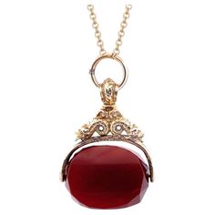 Elevate your style with our extraordinary 10K yellow gold Spinning Carnelian Watch Fab Pendant. This exquisite pendant showcases a beautiful carnelian stone that spins within an intricate gold holder. The captivating carvings on the gold holder add a touch of sophistication and artistry. Selling Price: $ 1400.00 Classic Red Intaglio Jewelry, Elegant Yellow Gold Carnelian Necklace, Elegant Carnelian Necklaces In Yellow Gold, Elegant Carnelian Necklace With Polished Finish, Yellow Gold Carnelian Jewelry With Polished Finish, Elegant Gold Carnelian Jewelry, Luxury Gold Carnelian Jewelry, Gold Carnelian Jewelry With Polished Finish, Luxury Carnelian Jewelry For Formal Occasions