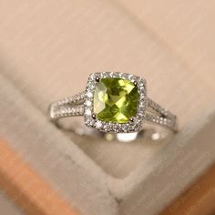 Green Peridot Ring Cushion Cut August Birthstone Ring - Etsy Elegant Lime Green Birthstone Promise Ring, Elegant Lime Green May Birthstone Ring, Classic Peridot Jewelry With Halo Setting, Elegant Lime Green Birthstone Rings, Elegant Lime Green Promise Ring, Silver Cushion Cut Ring With May Birthstone, Silver Cushion Cut Ring For May Birthstone, Peridot Birthstone Ring, Oval Shaped Engagement Rings