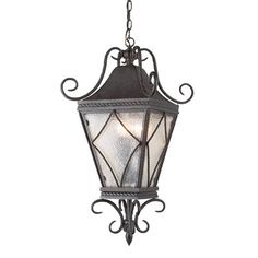 an old fashioned hanging light fixture on a white background